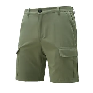 High-quality detailed view of olive green cargo shorts featuring functional side flap pockets