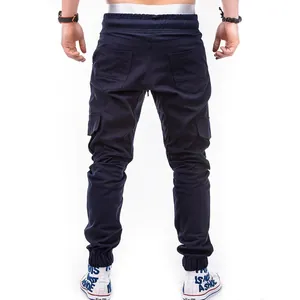 Back view of men's navy blue cargo jogger pants featuring a multi-pocket design