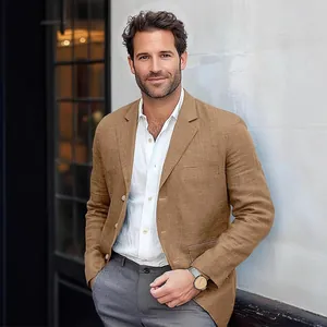 Detailed view of a men's tan linen blazer for casual business styling