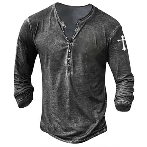 Close-up of men's vintage washed Henley shirt with cross print on sleeve