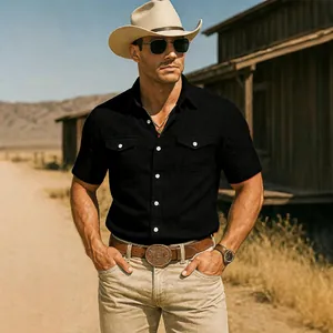 Close-up of men's black short-sleeve utility shirt with double pockets on model.