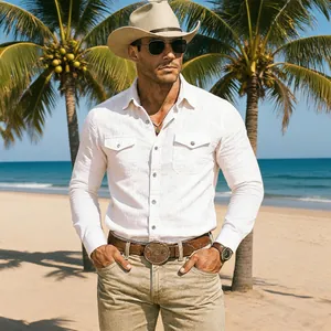 Man wearing a premium white linen long-sleeve shirt on a beautiful tropical beach setting