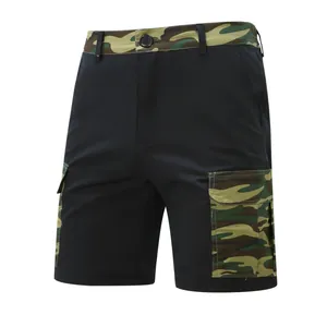 Detailed view of men's vintage cargo shorts with camouflage pockets and black fabric
