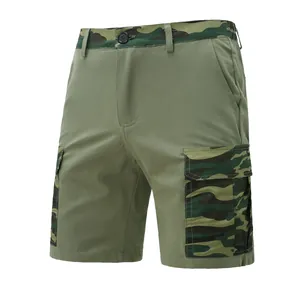 Detail view of men's olive green cargo shorts featuring camouflage pocket accents.