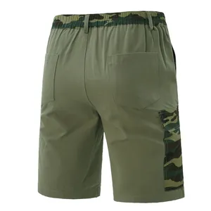 Back view detail of men's army green cargo shorts with camouflage accents on waist.