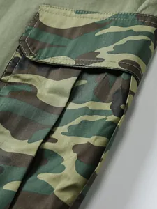 Close-up detail of vintage men's cargo shorts featuring a camouflage patterned pocket