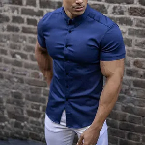 Close-up detail of a dark navy blue muscle fit short sleeve shirt for athletic men