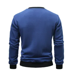 Back view of a men's solid blue polar fleece crewneck sweatshirt with black ribbed trim