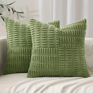 Macro view of stitched corn grain texture on soft light green corduroy pillow covers