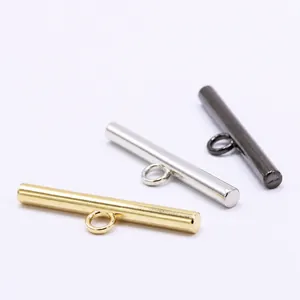 Close-up of metal bar shank buttons in gold, silver, and gunmetal finishes for suits