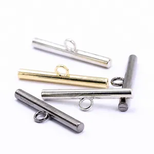 Close-up of alloy metal bar toggle buttons in gold, silver, and gunmetal finishes