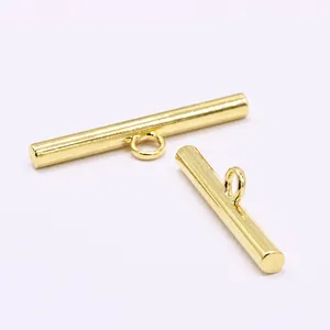 Detailed macro view of gold-tone metal long bar toggle buttons for suit decoration