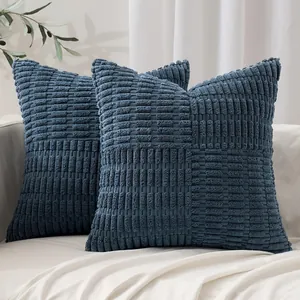 Close-up of blue patchwork corduroy pillow covers with textured corn kernel pattern