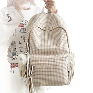 Minimalist Korean style checkered backpack for school featuring a cute plush pendant