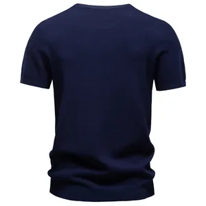 Detailed back view of a textured navy blue short-sleeve knitted T-shirt for men