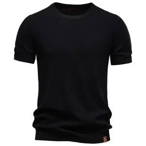 Detailed view of a premium black men's crew neck knit T-shirt with breathable mesh texture