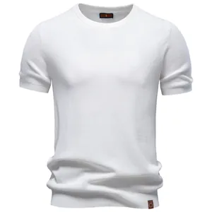 High-quality detail view of a white men's casual crew neck knitted T-shirt with textured fabric