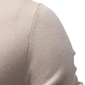 Detailed view of men's crew neck T-shirt shoulder highlighting the breathable knit texture