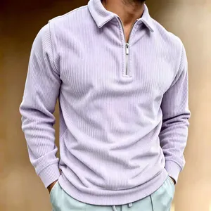 Detailed view of a men's light purple corduroy quarter-zip polo sweatshirt for autumn.