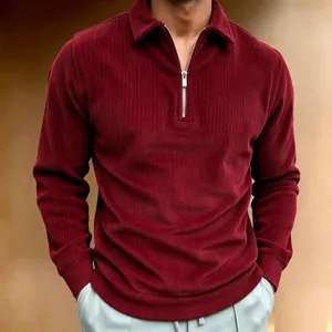 Close-up of burgundy corduroy long-sleeved polo shirt with silver half-zip detail