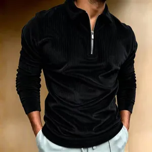 Detailed view of men's black corduroy long-sleeve polo shirt with quarter-zip collar