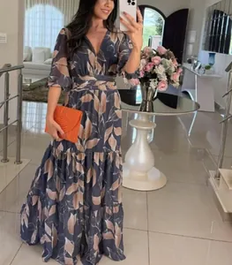 Full-length view of an elegant V-neck floral print maxi dress in lifestyle setting