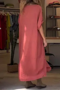 Back view of a loose salmon pink cotton linen summer dress with casual short sleeves