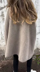 Back view of a cozy taupe oversized wool cloak coat for autumn and winter fashion.