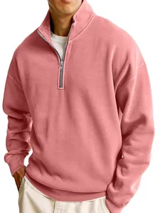 Close-up of men's pink half-zip sweatshirt featuring a stylish stand collar design