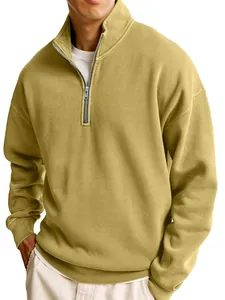 Close-up of men's mustard yellow half-zip sweatshirt showing collar detail and soft fabric