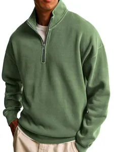 Close-up detail of a men's olive green half-zip sweatshirt with a stylish stand collar