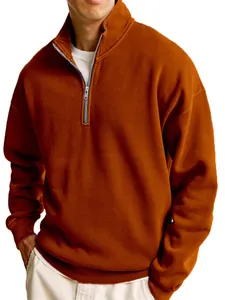 Close-up of men's burnt orange half-zip sweatshirt with stand collar and casual style