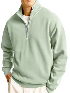 Detail view of men's sage green half-zip sweatshirt showing collar and zipper