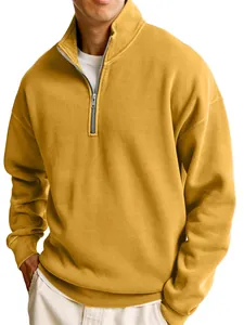 Close-up of men's mustard yellow half-zip sweatshirt with a stylish stand collar design