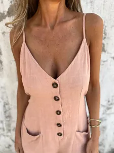 Close-up of women's v-neck cotton linen jumpsuit with button-down front and pockets