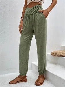 Women's casual green high-waisted joggers with pockets and stylish elastic tapered cuffs