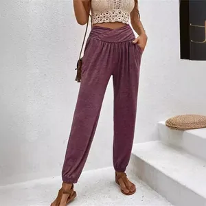 Stylish women's high-waisted purple leisure pants featuring side pockets and cuffed hems
