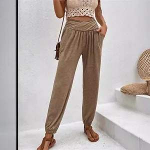 Women's high-waisted lounge joggers with cross-waist design and pockets in casual brown