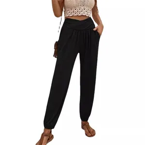 High-waist black harem pants with pockets and elastic cuffs for women in casual style