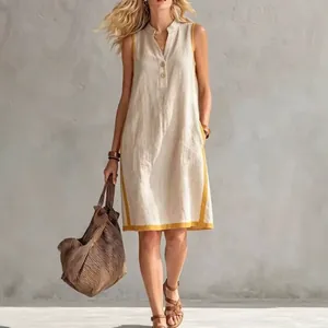 Summer V-neck sleeveless loose cotton linen dress with yellow trim shown on model
