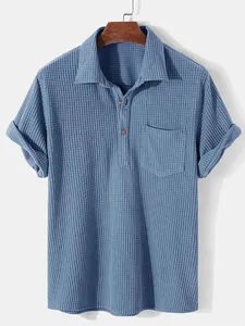 Detailed view of the blue corduroy fabric and lapel collar of a men's casual shirt