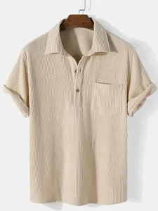 Close-up of men's beige corduroy short-sleeve shirt with polo collar and pocket