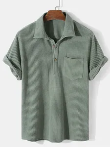 Detailed view of olive green waffle knit corduroy men's shirt with front pocket