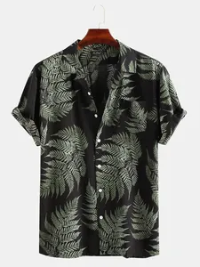 Close-up of men's casual short-sleeve beach shirt with tropical fern leaf print