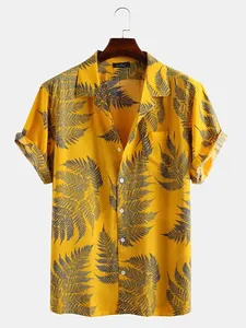 Bright yellow Hawaiian shirt featuring grey fern leaf prints and classic short sleeves