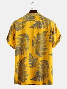 Detailed back view of yellow short sleeve shirt with blue tropical fern prints