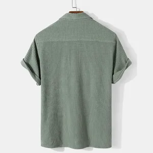Detailed back view of a men's sage green textured corduroy short sleeve button down shirt