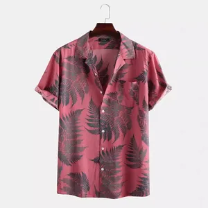 Men's Hawaiian short sleeve shirt with green fern leaf print on a dusty pink background