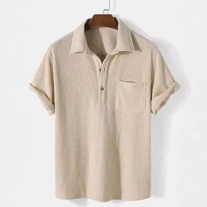 Beige men's corduroy short-sleeved lapel shirt with pocket and wooden hanger.