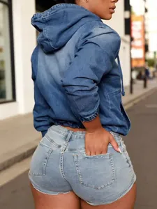 Close-up back view of a washed blue denim hooded bomber jacket with an elasticated waist